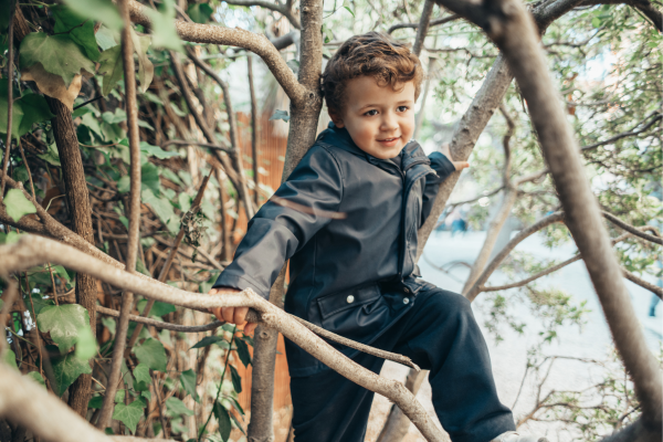 Summer Website - Forest School Boy climbing tree