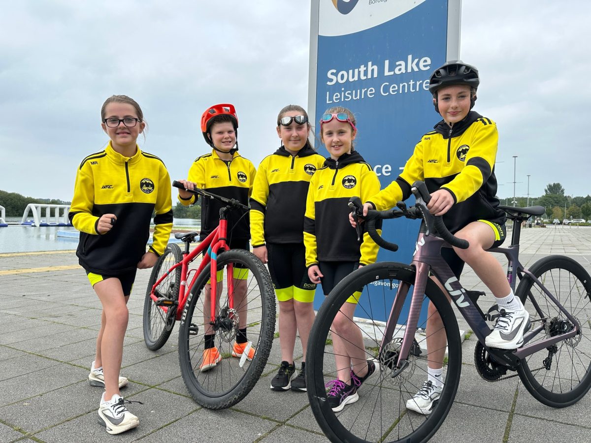Five young triathletes pictured beside South Lake in Craigavon.