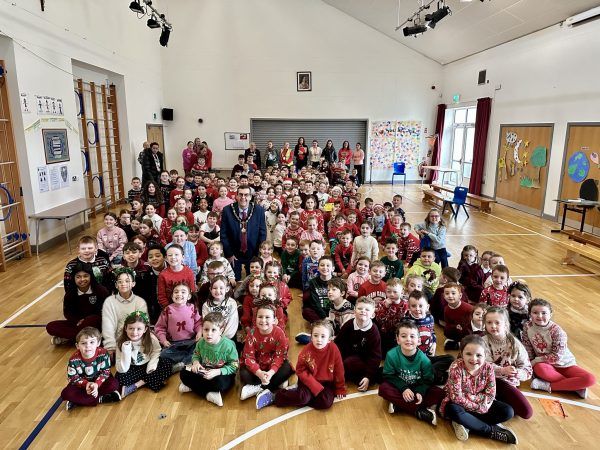 The Lord Mayor Alderman Stephen Moutray in among a large group of pupils and staff from St Teresa's Primary School.